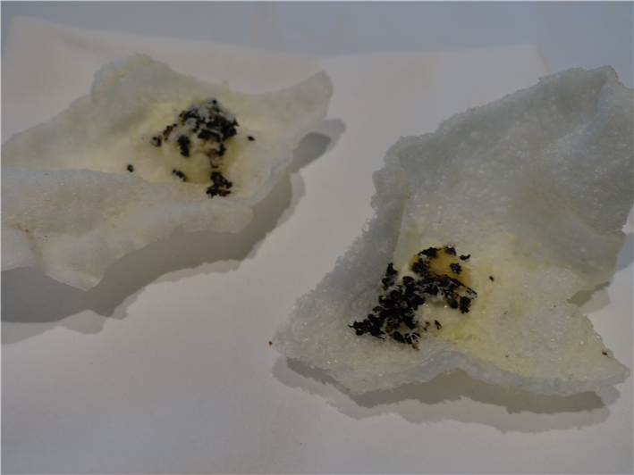 cheese cracker nibbles with black olive crumb